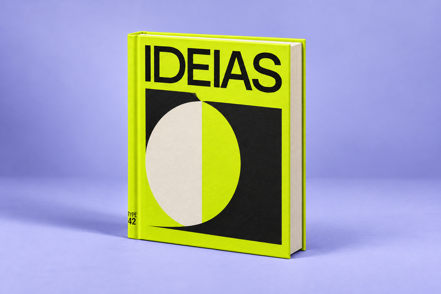 Ideias: livro verde-lima com formas gráficas pretas e brancas, sobre um fundo lilás.